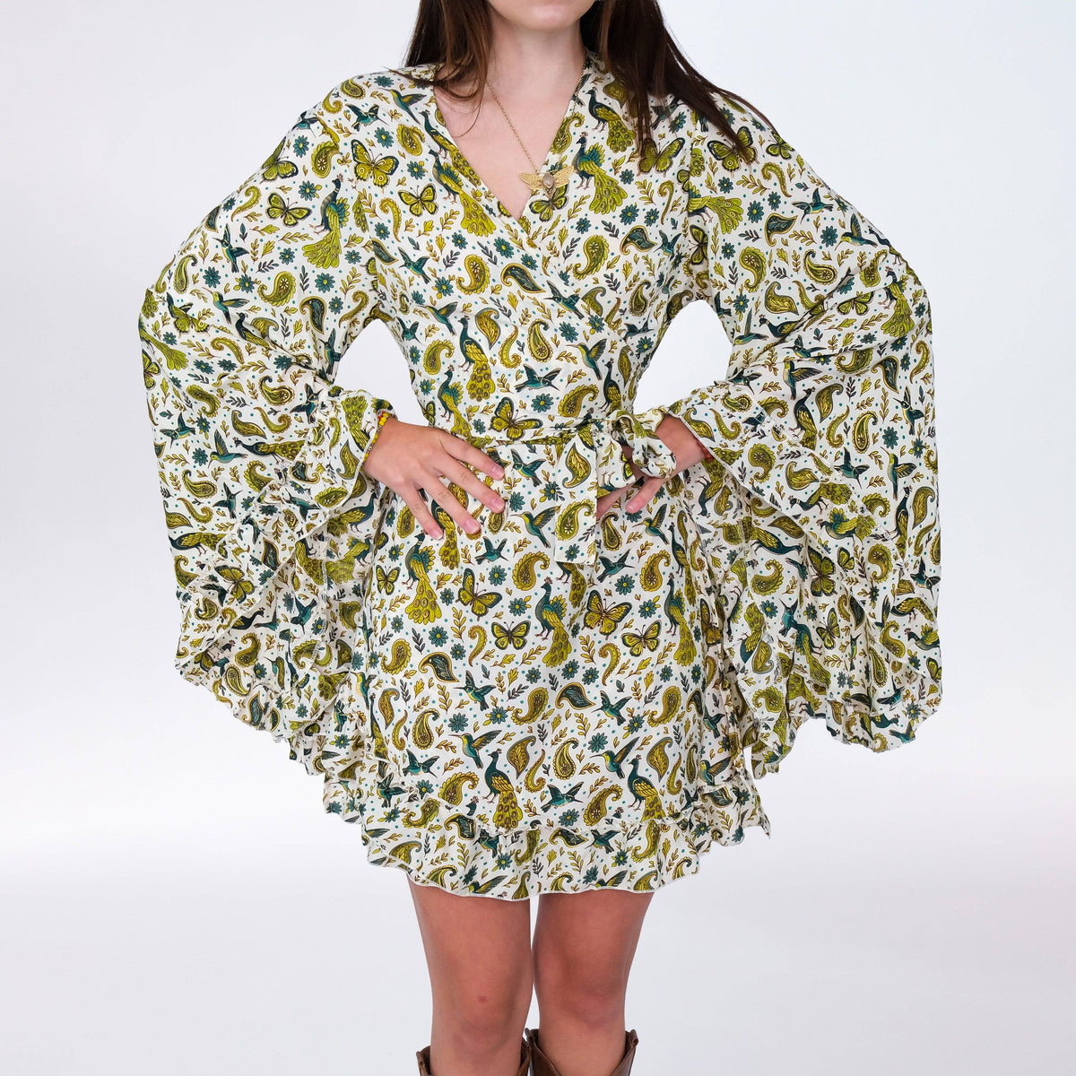 Woman wearing a floral patterned dress on a white background