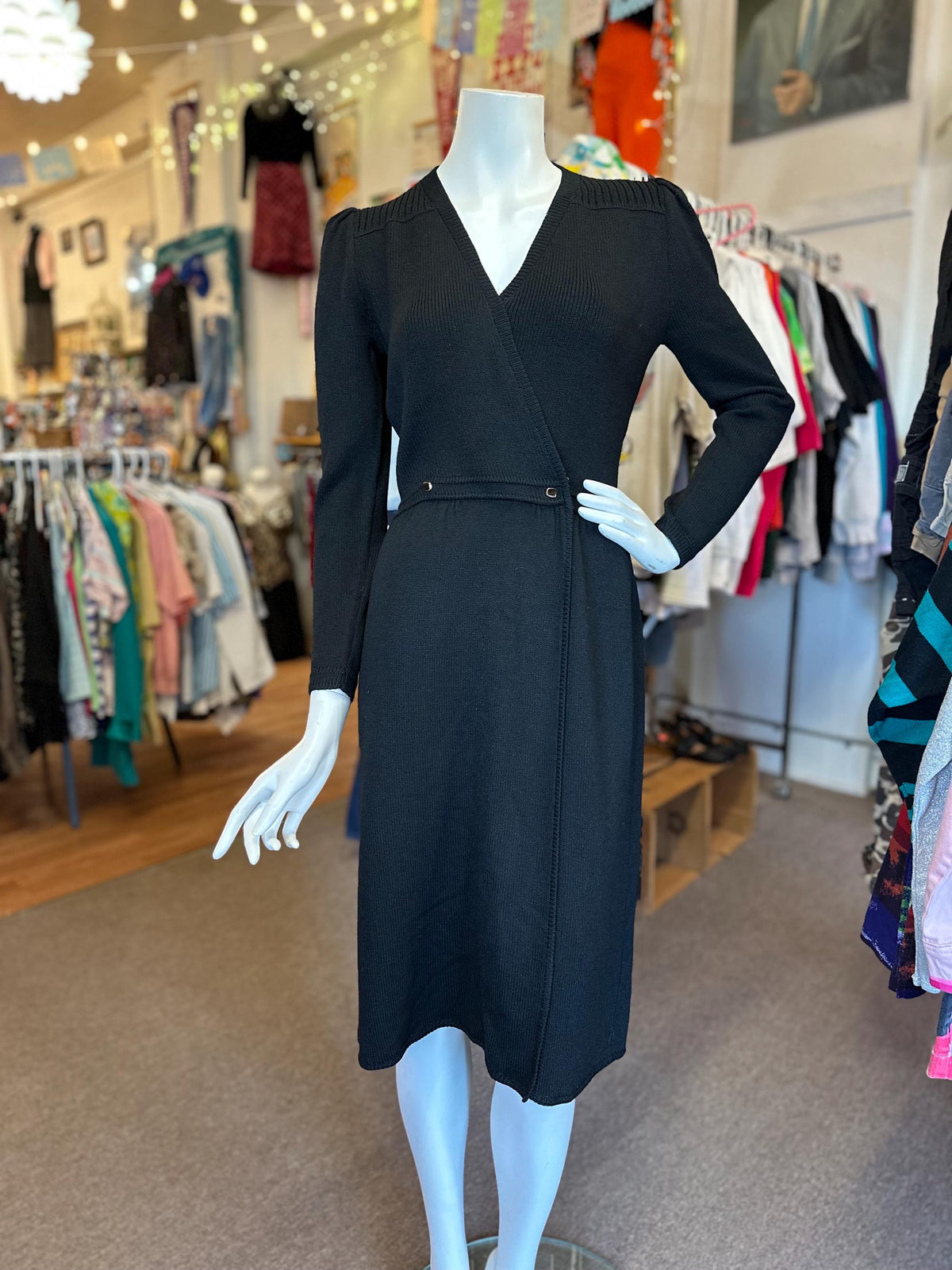 Black dress on a mannequin in a clothing store