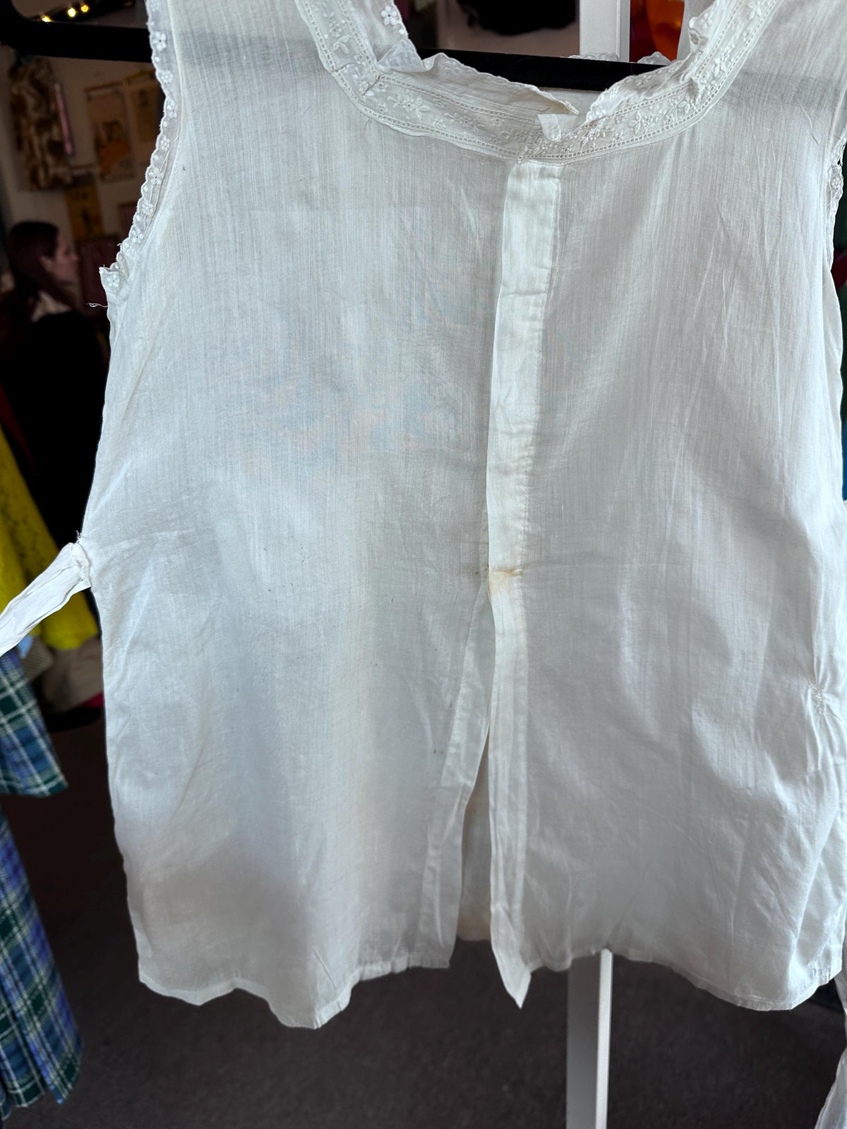 White blouse on a hanger with a blurred background
