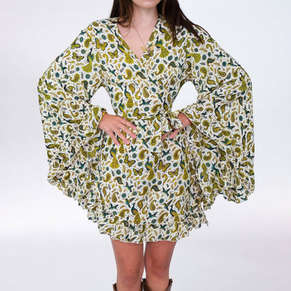 Woman wearing a floral patterned dress on a white background