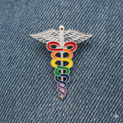 Rainbow caduceus symbol on a denim background