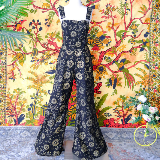 Navy blue floral-patterned dress against a colorful floral and bird fabric background