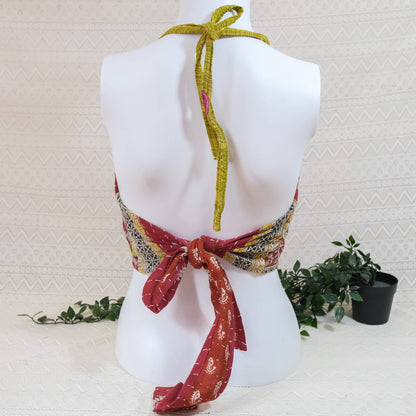 Colorful halter top on a mannequin with a white background