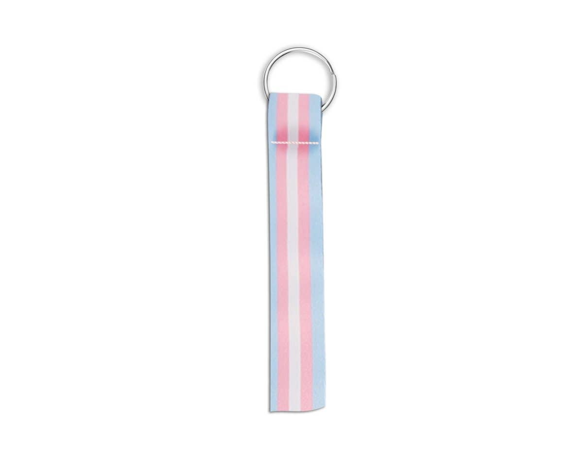 A fabric keychain strap with vertical pink, white, and light blue stripes, attached to a silver metal split ring, shown on a plain white background.