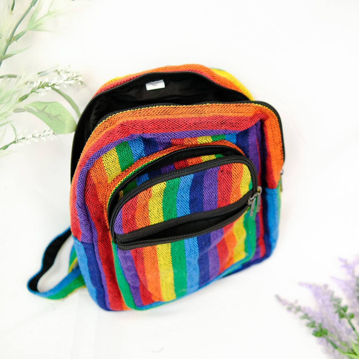 Colorful striped bag with a zipper on a light background