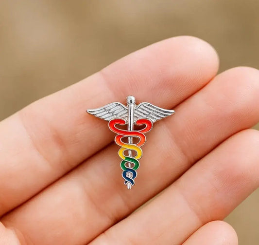 Colorful caduceus symbol on a hand with a blurred background