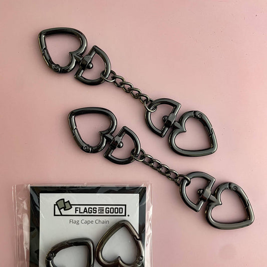 Heart-shaped keychain with packaging labeled 'Flags for Good' on a pink background