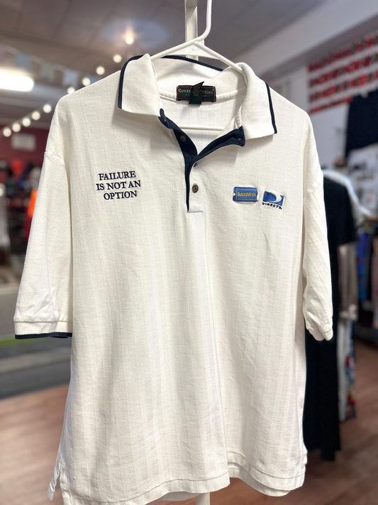 White polo shirt with text and logo on a hanger in a store setting