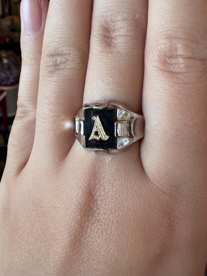 Ring with letter 'A' on a finger